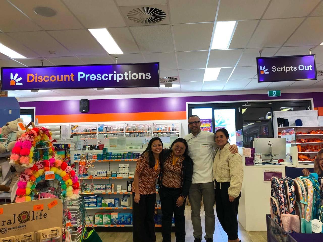PBAC founder with a partner pharmacy team on the retail floor